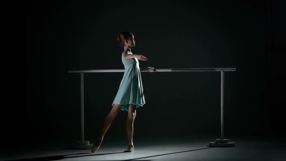 Little Ballerina in the Ballet Hall on Ballet Barre