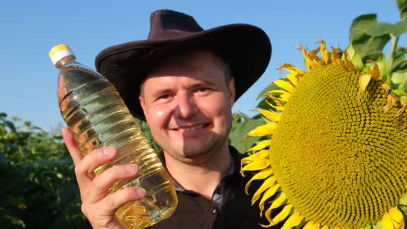 A European Farmer Demonstrates a Sunflower Oil Product Right in the Field
