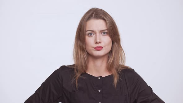 Young Beautiful Disagreed Fairhaired Girl Over White Background