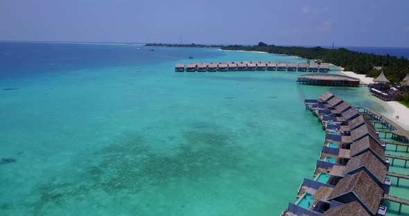 Beautiful birds eye abstract shot of a paradise sunny white sand beach and aqua blue water background