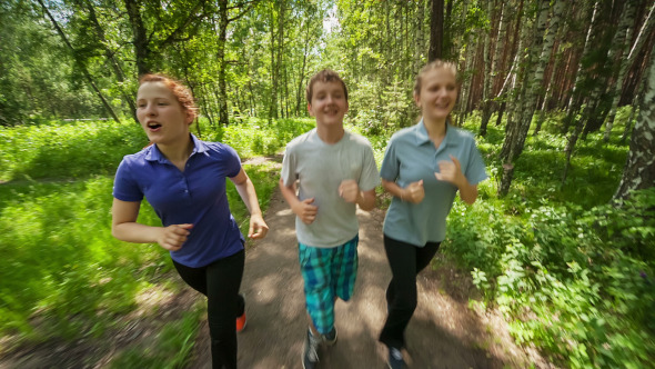 Teenagers Jogging in Wood Park