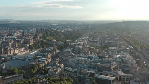 Wide rising drone shot of Edinburgh New Town West End at sunset