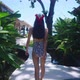Back View Girl In Swimming Suit Walking Alone In Resort On Sunny Day Slow Motion - VideoHive Item for Sale