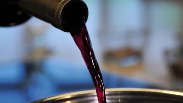 Red Wine Is Poured Into the Pan for Cooking Mulled Wine