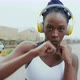 Young woman with headphones boxing in city, Milan, Italy - VideoHive Item for Sale