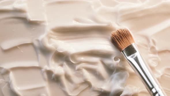 Smearing Cream on White Background Using Brush