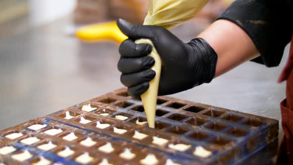 Confectioner Filling Mold By Cream at Pastry Shop 10