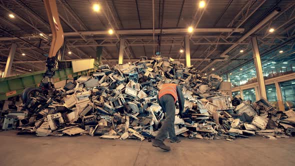 Debris of Rubbish Are Being Inspected By a Specialist