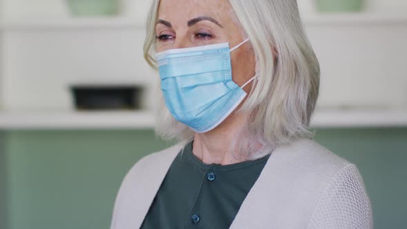 Portrait of senior caucasian woman wearing face mask