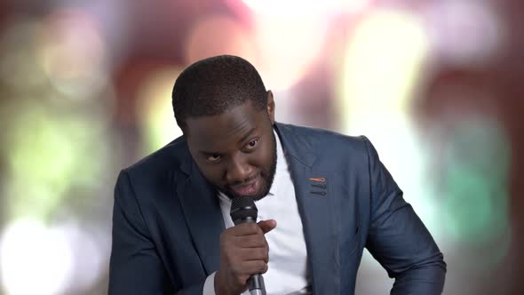 Afro-american Man Talking Into Microphone.