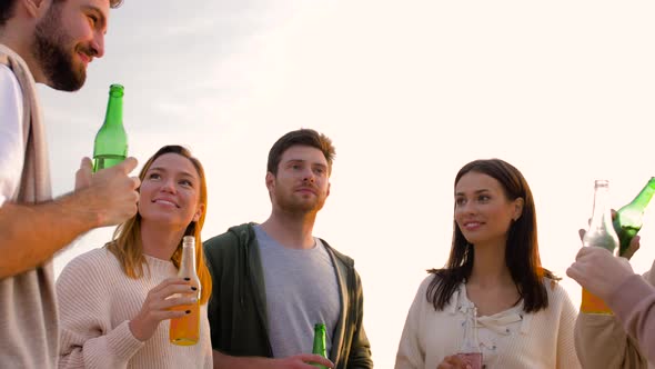 Friends with Non Alcoholic Drinks Talking on Beach