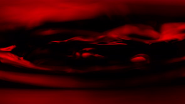 Super Slow Motion Macro Shot of Swirling Red Wine in Glass at 1000Fps.