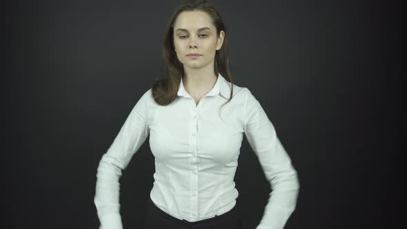 Confident Brunette Model in White Blouse Poses for Photo Set