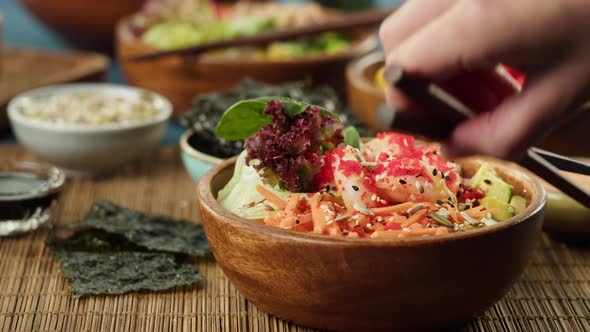 Eating Poke Bowl Closeup Taking Shrimp Using Chopsticks