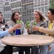 Attractive Young Women of Mixed Race Partying Outside in the City Drinking Cocktails and Smiling and - VideoHive Item for Sale
