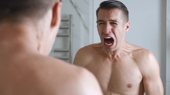 Desperate Lonely Man Looks Himself Bathroom Mirror Screams Grief