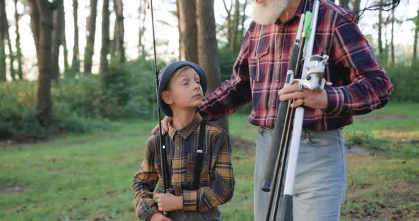 Grandfather Telling Different Fishing Stories to His Interested Small Grandson, Going Fishing