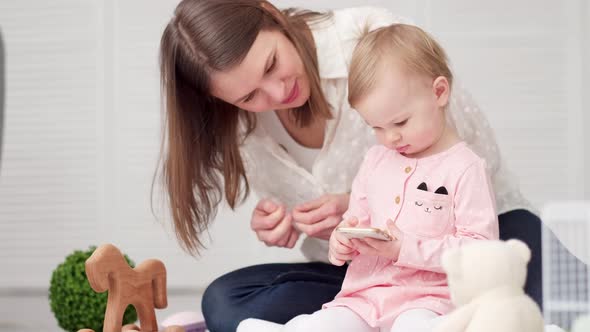 Little Baby Girl and Mommy Playing Color Wooden Toys at Home Mother and Daughter Laughing Having Fun