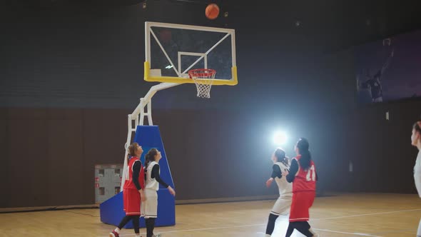 Basketball Championship Female Player Makes an Failure Attempt to Throw the Ball Into the Basket the
