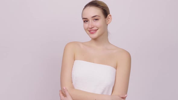 Cheerful Female in Towel Looking at Camera