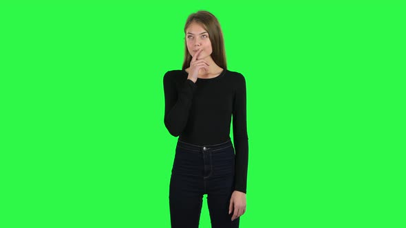 Young Woman Daydreaming and Smiling Looking Up. Green Screen