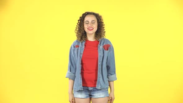 Curly Female Pointing Up Fingers. Girl Advertises Actively Gesticulating