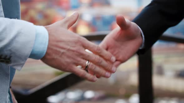Close Up Shot of Two Business Partners Making a Deal and Shaking Hands for Agreement Outdoors on