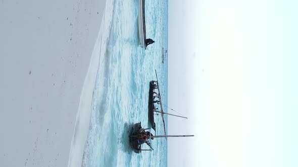 Vertical Video Boats in the Ocean Near the Coast of Zanzibar Tanzania Aerial View