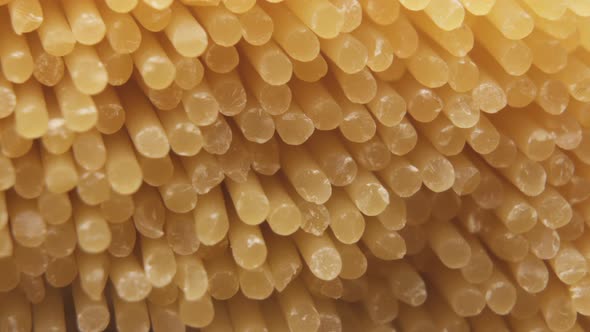 Close-up of a Bunch of Uncooked Dried Spaghetti, Noodles. Italian Pasta Background