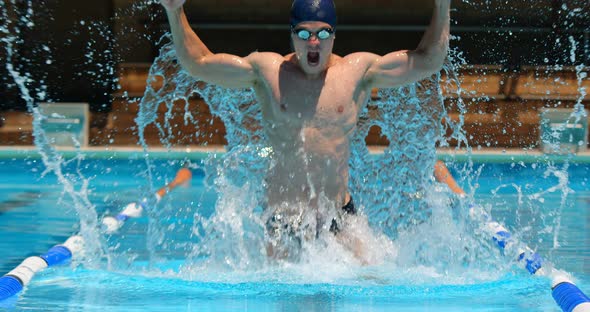 Male swimmer react after winning the race 4k