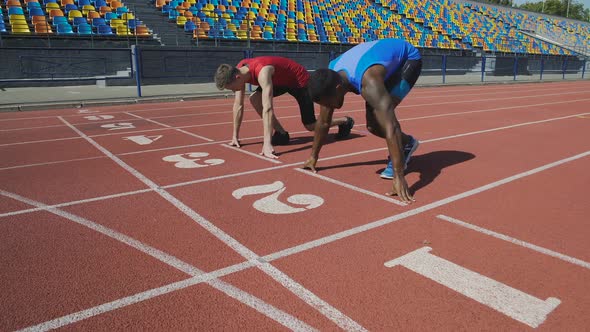 Two Multiracial Athletes Getting to Start and Running After Command, Marathon