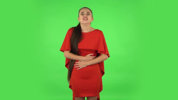 Pretty Young Woman Is Feeling Very Bad, Her Stomach Hurting. Green Screen