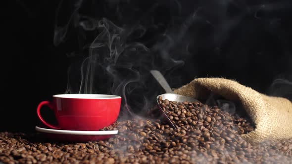 Coffee Cup And Coffee Beans In Hemp Sack With Steam