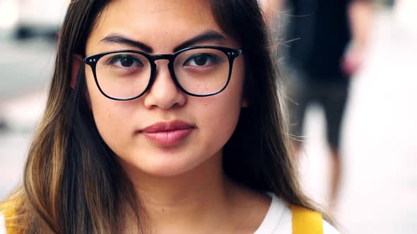 Young Asian American Woman with Neutral Expression, No Emotion