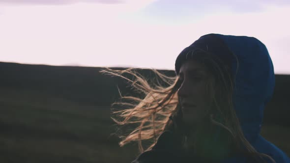 Cinematic Shot of Young Woman Enjoying Sunset on Field Slow Motion