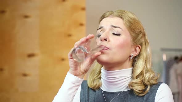 Pretty Female Taking Pills for Toothache. Blond Woman Having Strong Dental Pain