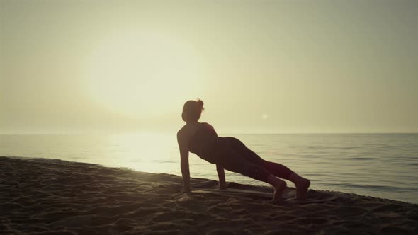 Silhouette Yoga Woman Exercising on Beach