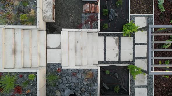 Modern Residential Backyard Garden with Illuminated Concrete Stairs.