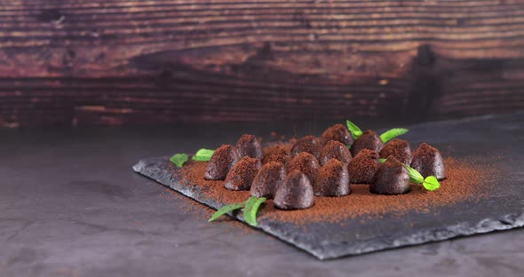 Powdering with Cocoa Chocolate Truffles on Slate