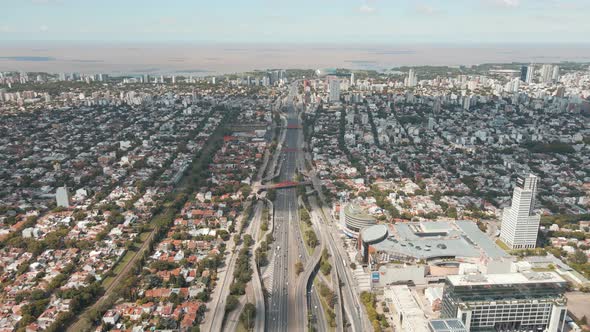 Aerial parallax shot of General Paz Avenue and La Plata river on background in Buenos Aires