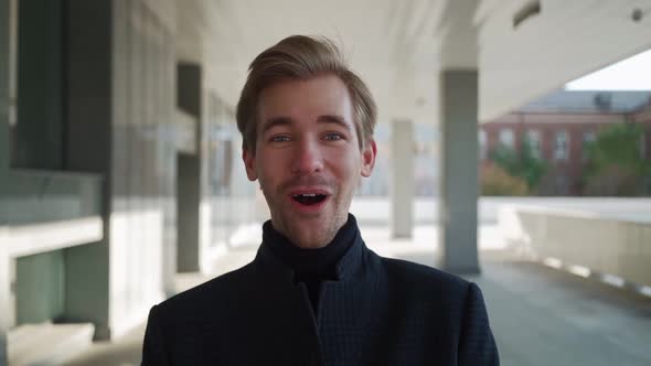 Portrait Happy European Man Dancing with Folder of Documents in Hand in Urban