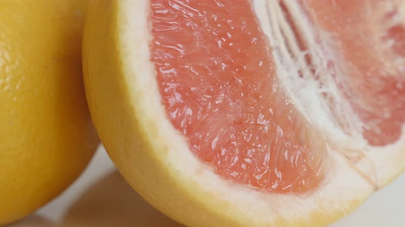 Close-up of sliced red Citrus paradisi grapefruit tilting footage