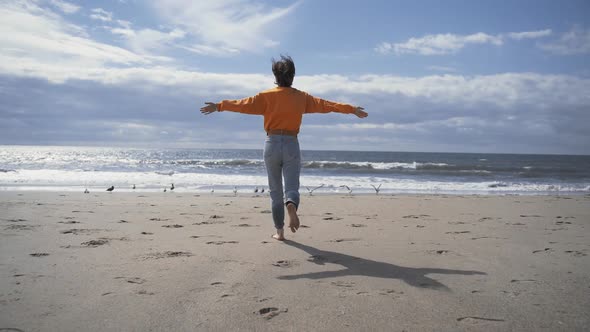 Running girl with seagulls 