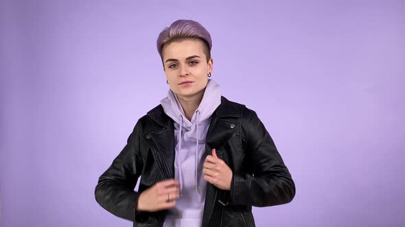 Young Person Putting on Leather Jacket Admiring Cool Look Isolated