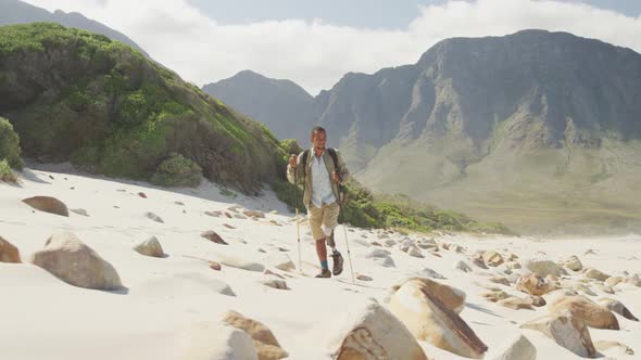 Sporty mixed race man with prosthetic leg hiking