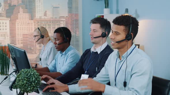 Multiracial Call Center Agent Feeling Exhausted and Broken-down After Telephone Call with the Client