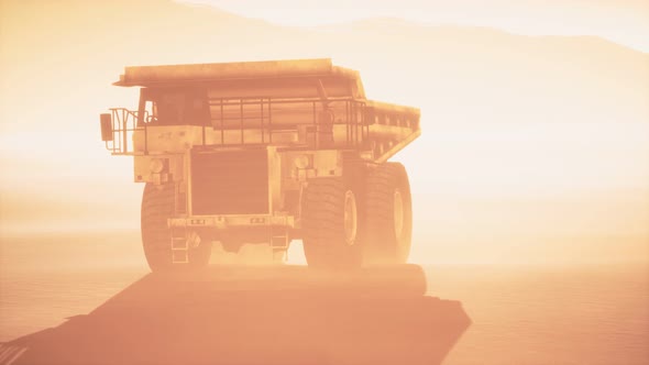 Big Yellow Mining Truck in the Dust at Career