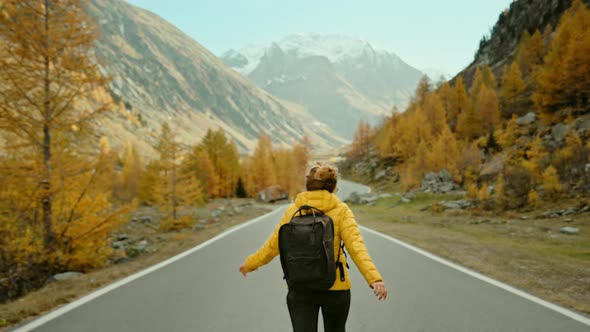 Woman Traveller on Hike in Epic Autumn Mountains