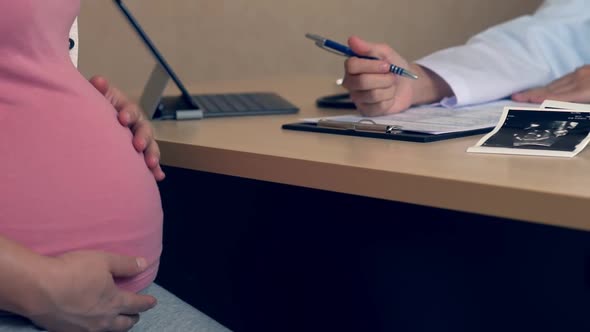 Pregnant Woman and Gynecologist Doctor at Hospital