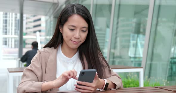 Business Woman Use of Smart Phone at Outdoor Cafe